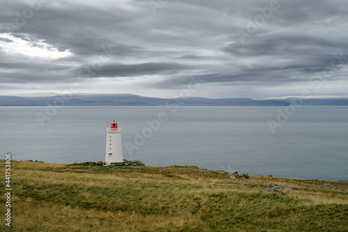 Lighthouse on the cliff near the ocean in Northwest Iceland