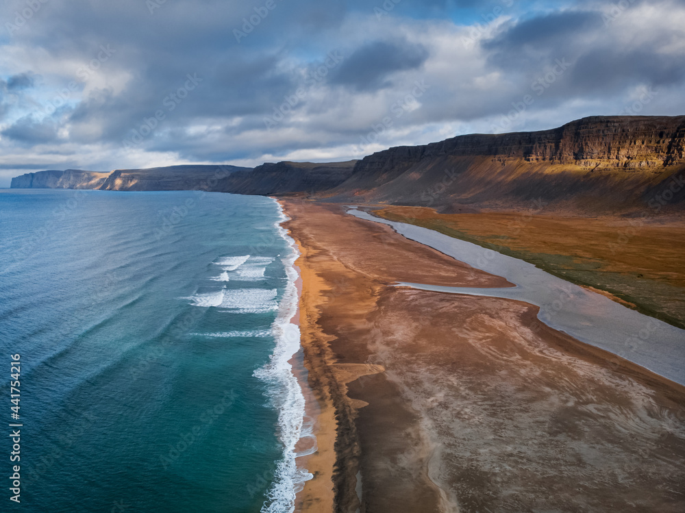 Raudisandur Beach with red sand, aerial view from drone, West Fjords or The Westfjords region in Iceland. Nature landscape from above
