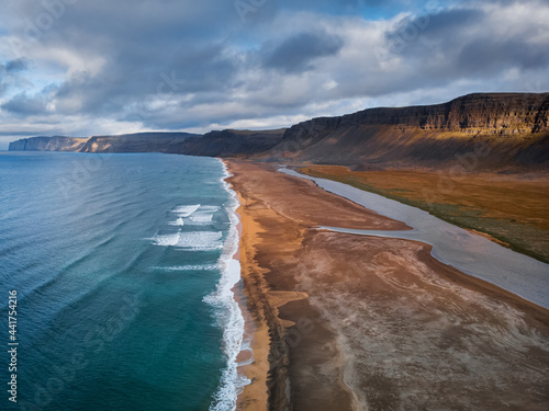 Raudisandur Beach with red sand, aerial view from drone, West Fjords or The Westfjords region in Iceland. Nature landscape from above