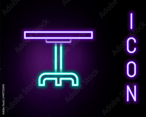 Glowing neon line Round table icon isolated on black background. Colorful outline concept. Vector