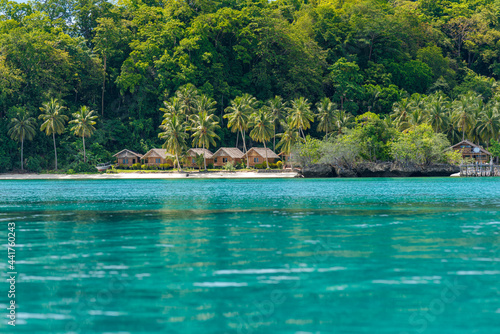 Coastline of the Togian Island Batudaka in the Gulf of Tomini in Sulawesi. Guesthouses at the Island beach. It's a paradise for divers and snorkelers and offers an incredible diversity of species © ksl
