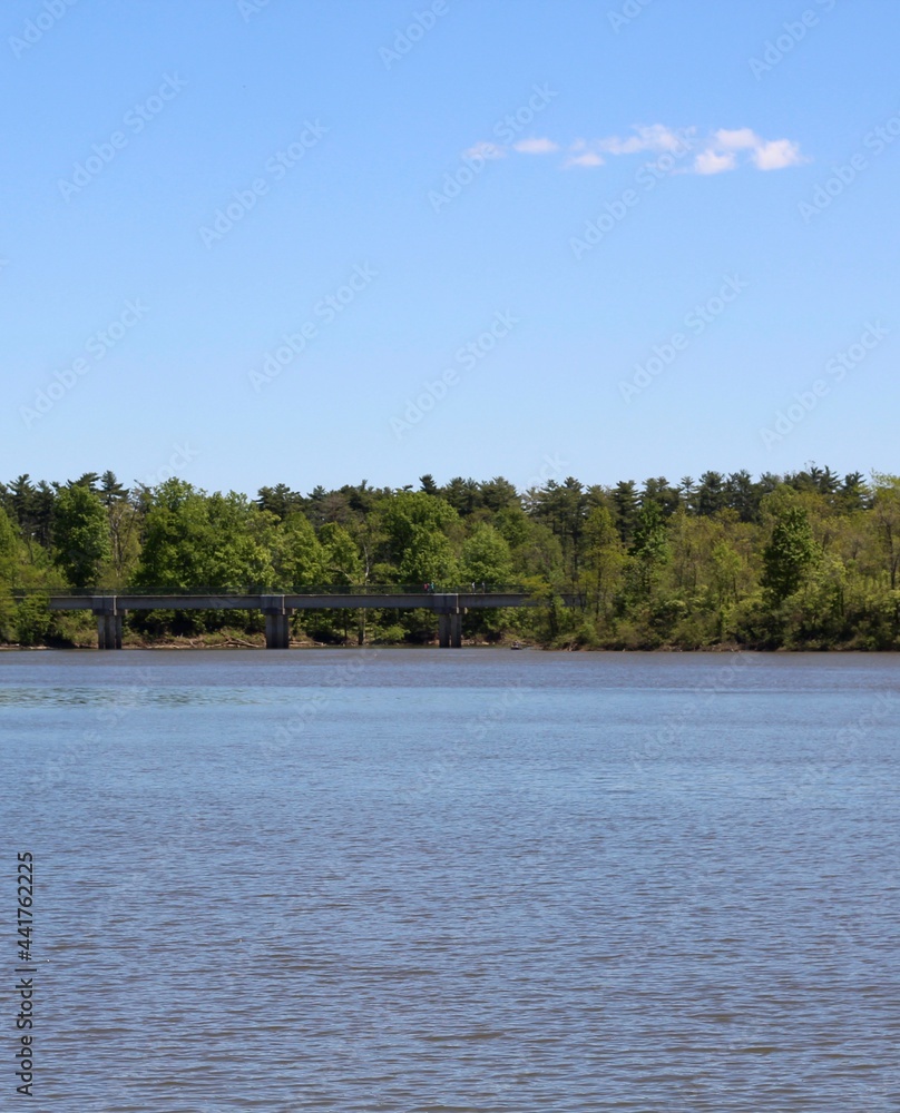 A beautiful sunny day at the lake in the park. A beautiful sunny day at the lake in the park.
