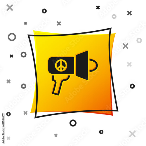 Black Megaphone icon isolated on white background. Speaker sign. Yellow square button. Vector