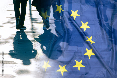 EU or European Union Flag and shadows of people, concept political picture. photo