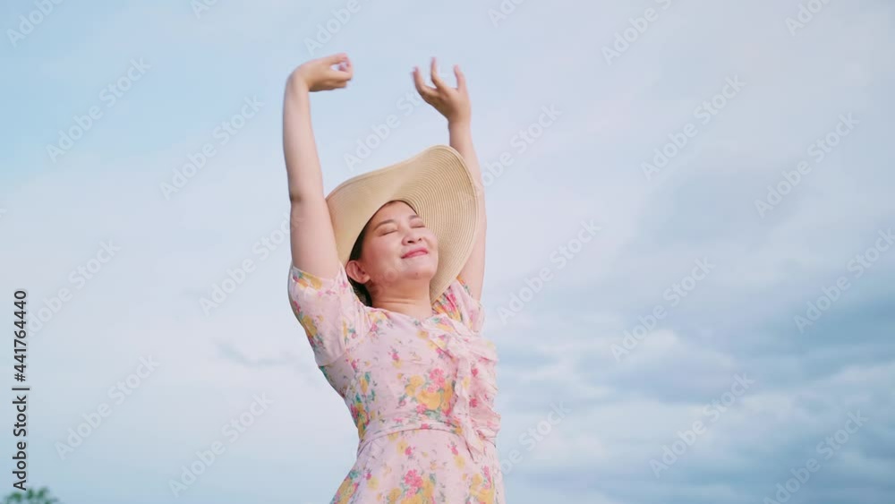 Portrait of beautiful Asian woman in hat relaxing with stretching. Portrait of beautiful Asian woman in hat relaxing with stretching.