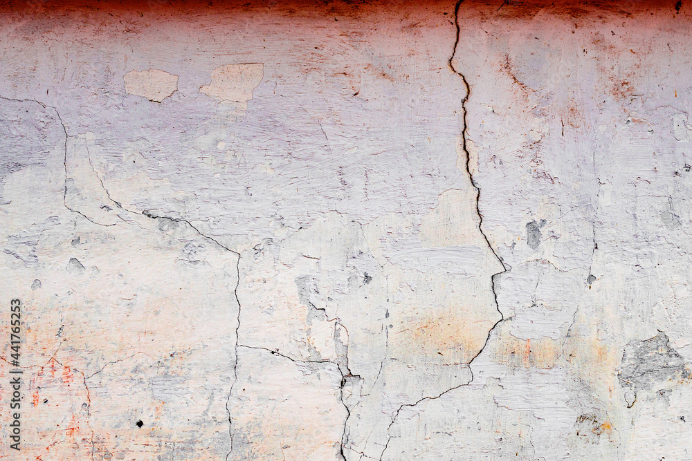 Texture of a concrete wall with cracks and scratches which can be used as a background