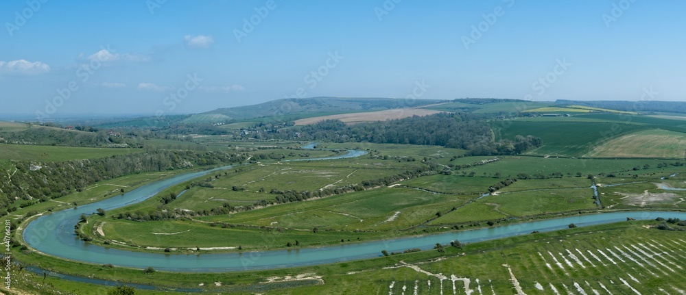 Panoramic view of the meandering Cuckmere river and valley from the High and Over footpath towards Alfriston. West Dean, Seaford, East Sussex, England
