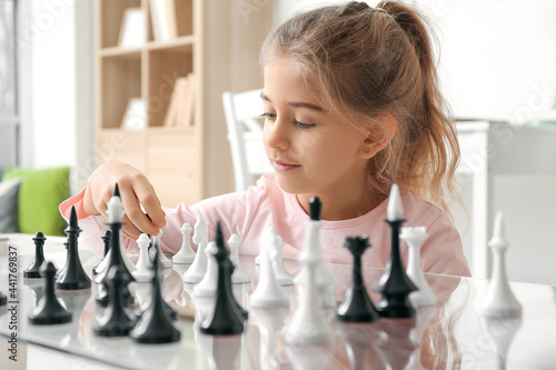 Cute little girl playing ch...