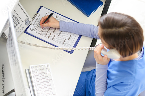 Female receptionist working...