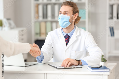 Young doctor working with p...