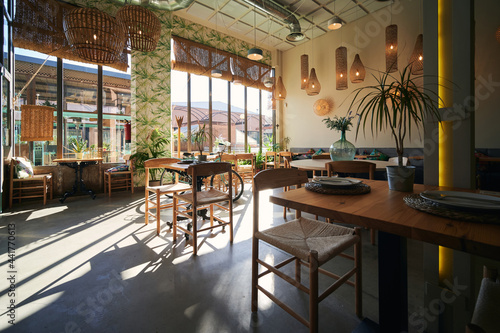 Interior of modern cafe with wooden furniture photo