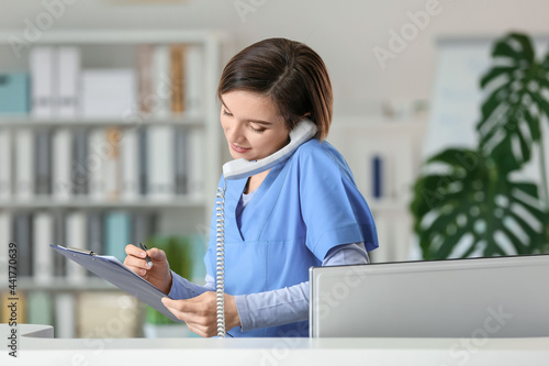 Female receptionist working...