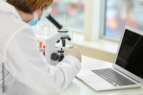 Female scientist working in...