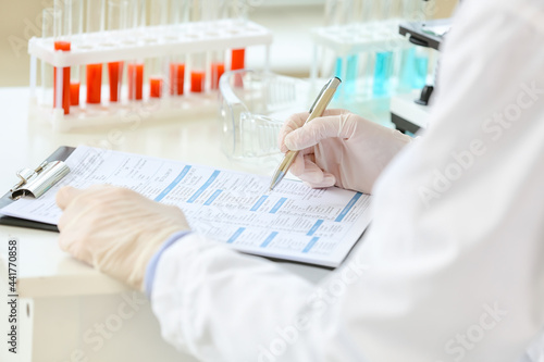 Female scientist working in...