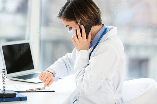 Female doctor working in cl...
