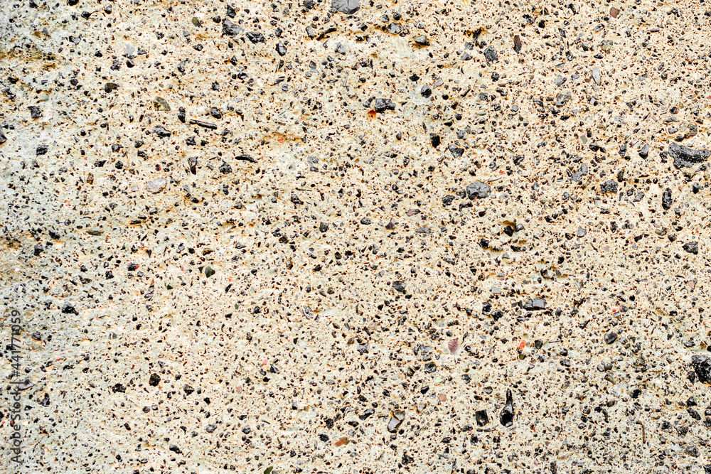 Texture of a concrete wall with cracks and scratches which can be used as a background Texture of a concrete wall with cracks and scratches which can be used as a background