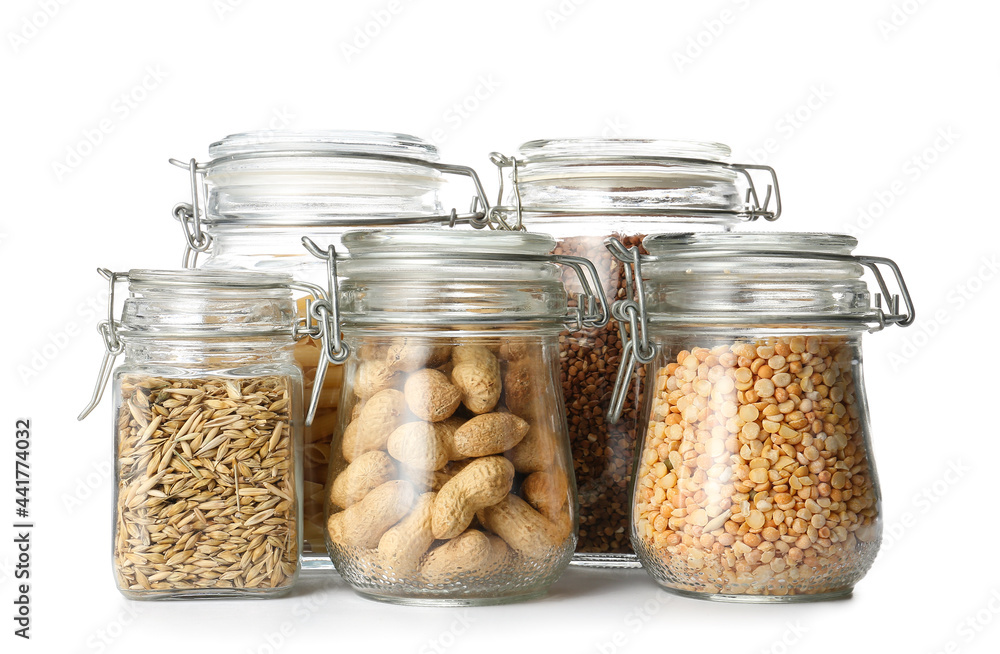 Glass jars with different products on white background Glass jars with different products on white background