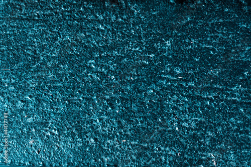 Niebieska brokatowa ściana, artystyczne tło, ciekawa tekstura.
