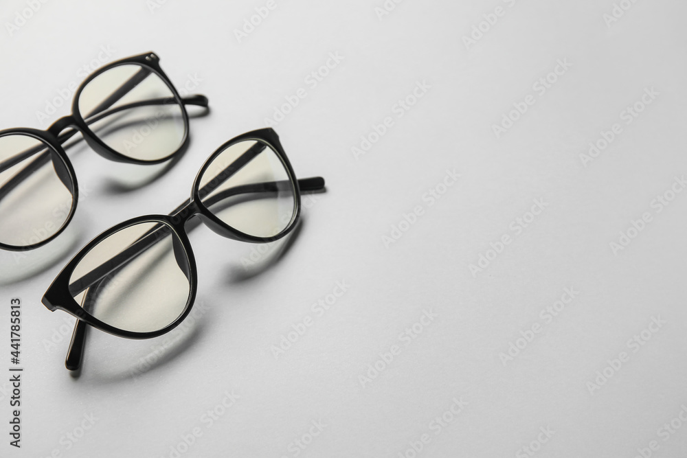 Different stylish eyeglasses on light background Different stylish eyeglasses on light background