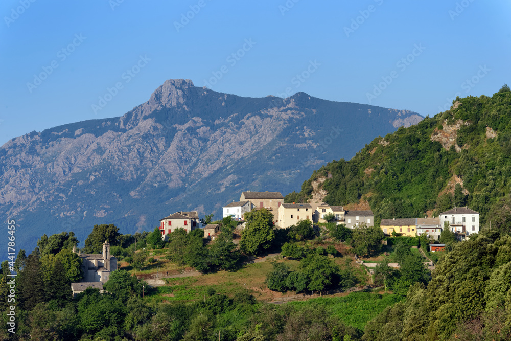 San Petrone peak and old village in Upper Corsica mountain. Piano village in the Castagniccia mountain