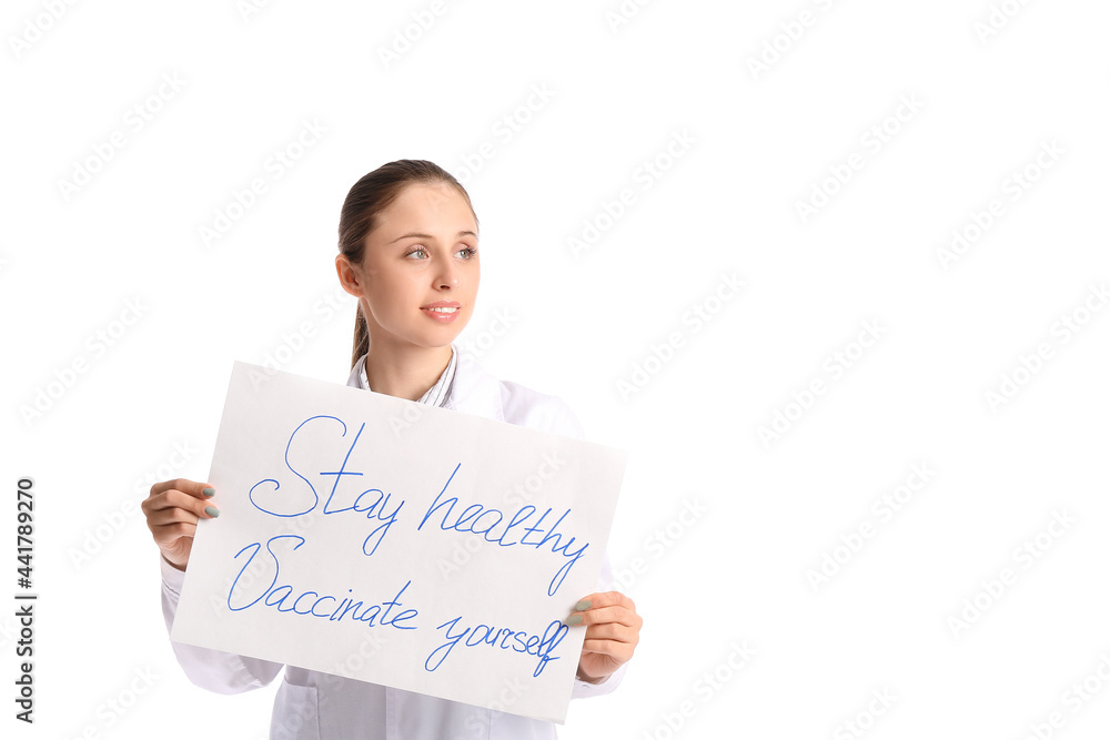 Female doctor holding poster with text STAY HEALTHY - VACCINATE YOURSELF on white background Female doctor holding poster with text STAY HEALTHY - VACCINATE YOURSELF on white background