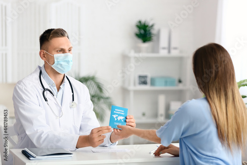 Doctor giving patient her i...