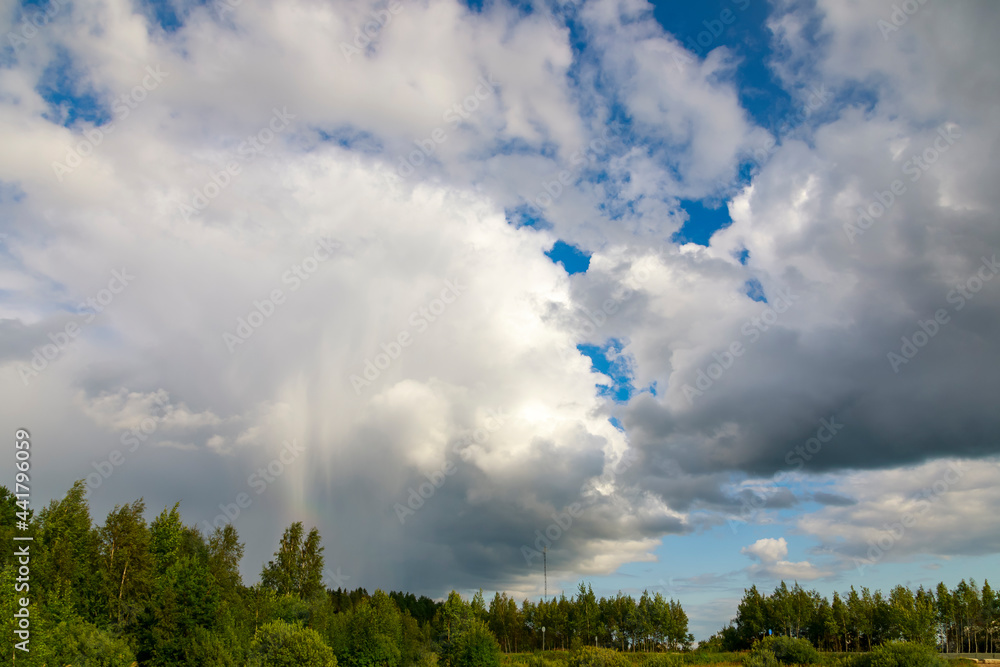 Huge white clouds over the forest with approaching rain. Huge white clouds over the forest with approaching rain.