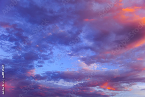 background dramatic sunset sky in lavender tones with orange clouds