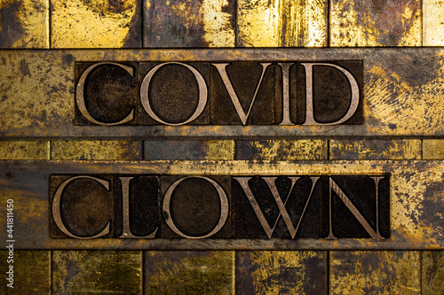 Canvas Print Covid Clown text on vintage textured grunge copper and gold background