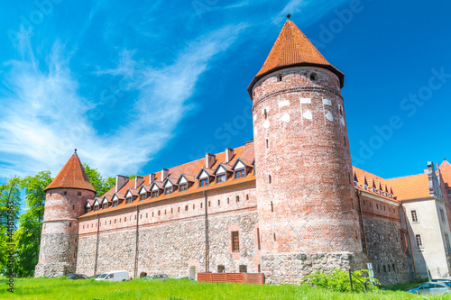 Castle of gothic Teutonic castle and a former stronghold for Pomeranian dukes at sunny day in Bytow, Poland. photo