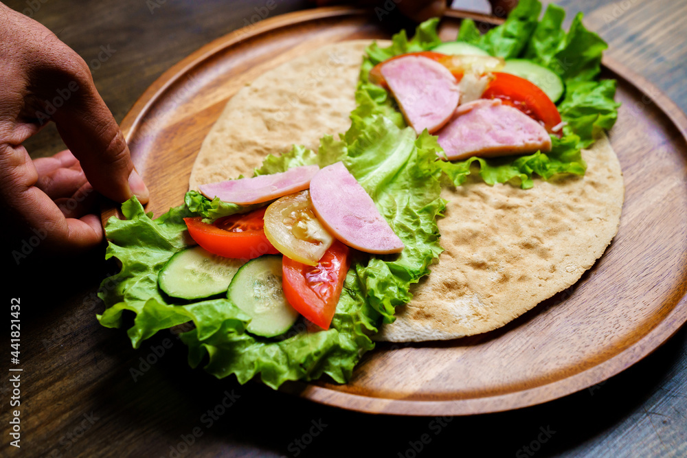 pita with vegetables and sausage.simple and delicious snack of flatbread