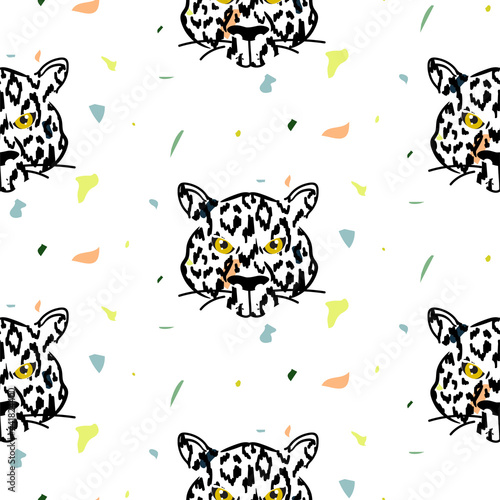 Tiger head seamless pattern with colored particles on the background. Wild leopard animal print