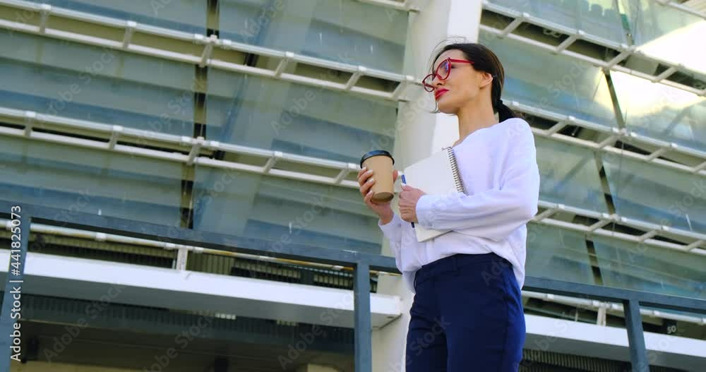 Portrait of beautiful smiling young entrepreneur businesswoman working in modern work station.Elegant businesswoman standing in office with tablet sexy girl with red lipstick and glasses on the street Portrait of beautiful smiling young entrepreneur businesswoman working in modern work station.Elegant businesswoman standing in office with tablet sexy girl with red lipstick and glasses on the street
