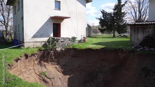 
A large sinkhole after an earthquake near the house photo
