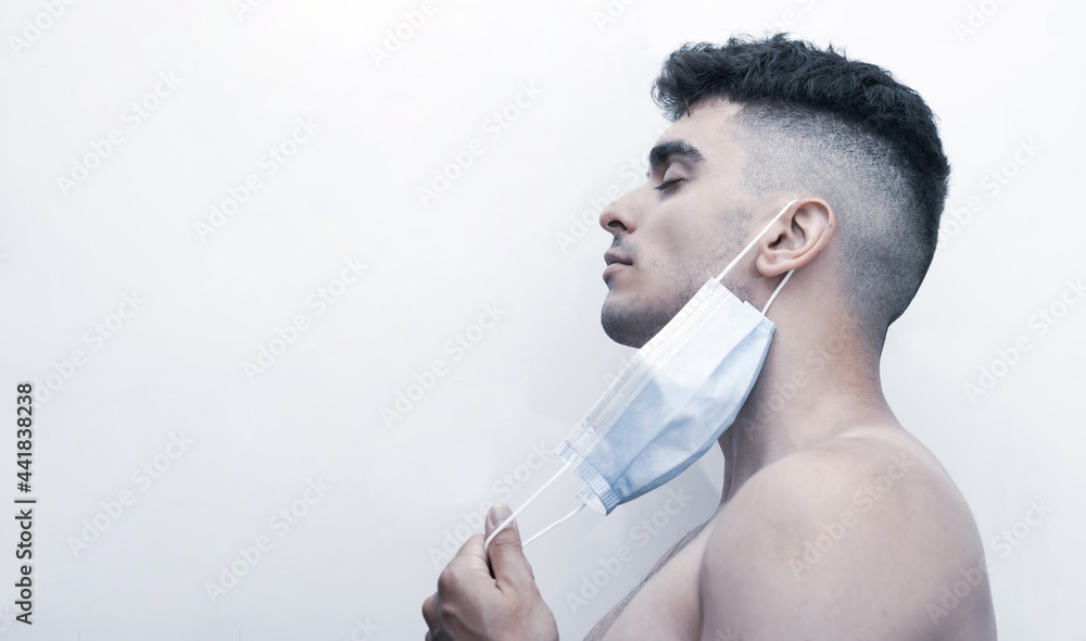 young man finally removing his mask.
free covid young man finally removing his mask.
free covid