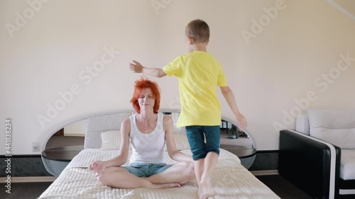 Relax on your bed. The child interferes with yoga. Mom is tired of homework. Day off.