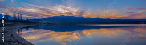 The reflected colors of the sunset in the dam. Panoramic view. Kyustendil  Bulgaraia
