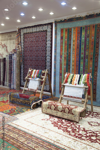 weaving and manufacturing of handmade carpets closeup. women's hands weave a carpet 