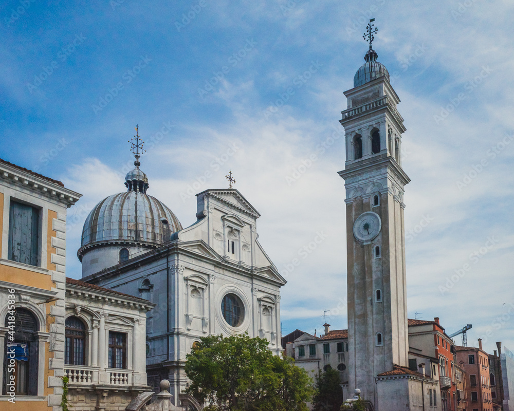 Tower and Church of San Giorgio dei Greci under blue sky in Venice, Italy