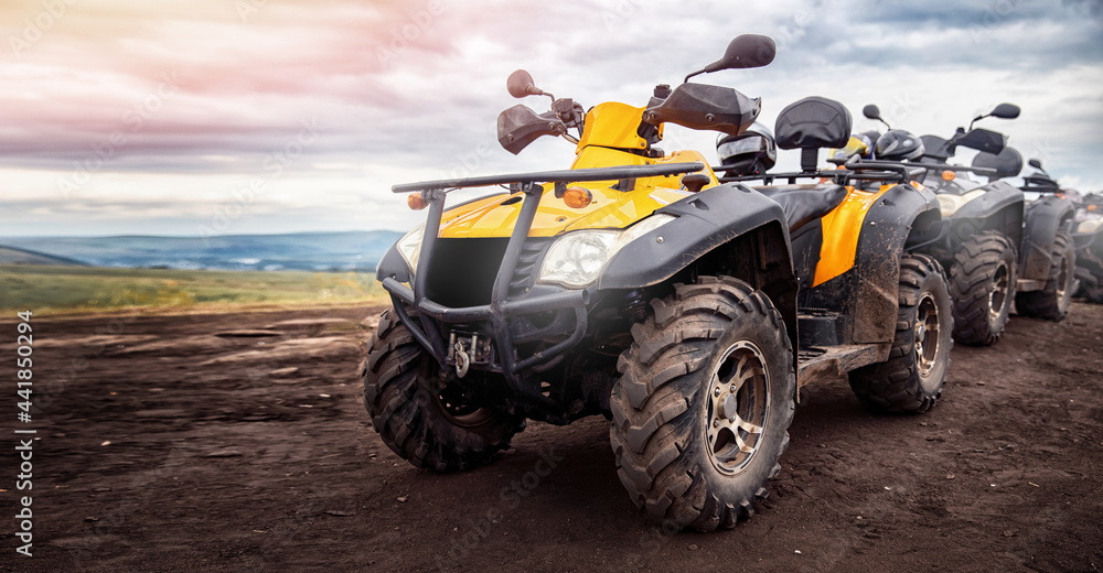 ATV quad bike on forest offroad. Concept banner motocross quadricycle trip background ATV quad bike on forest offroad. Concept banner motocross quadricycle trip background