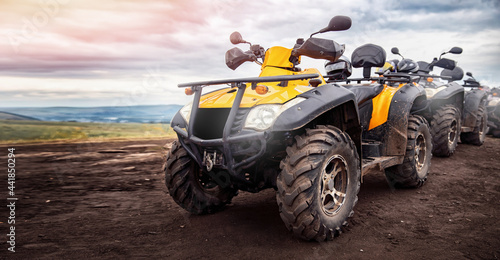 ATV quad bike on forest offroad. Concept banner motocross quadricycle trip background