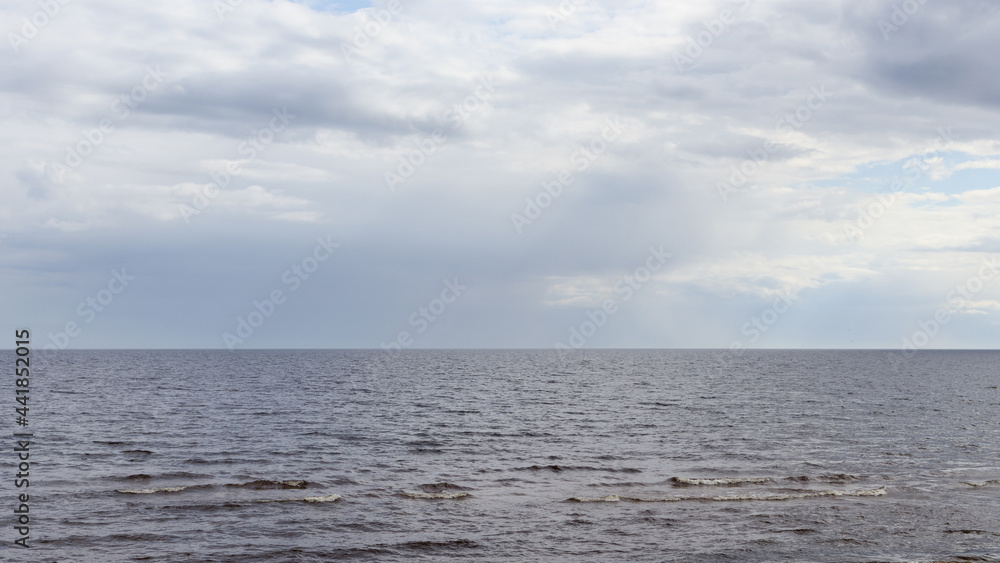 Fototapeta premium Cloudy weather above sea, lots of clouds