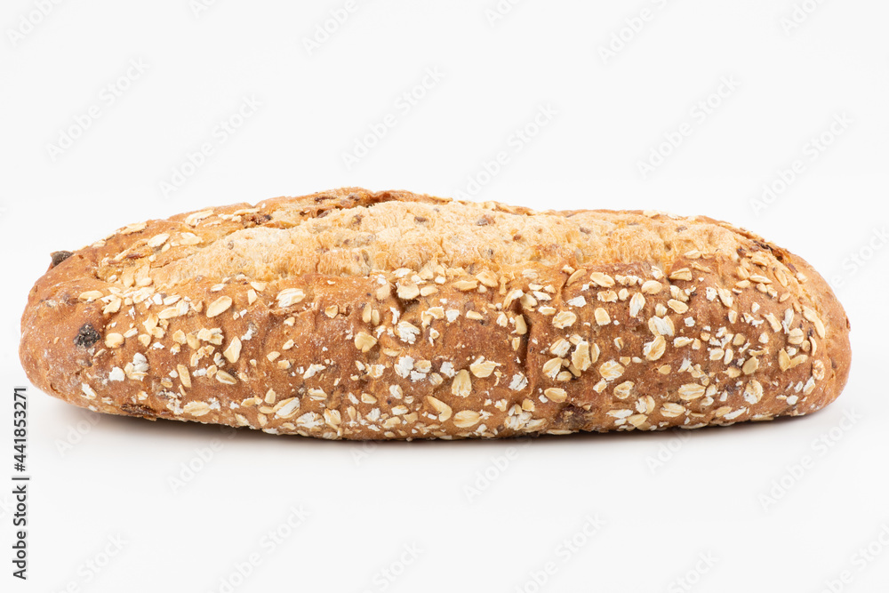 whole grain bread on the white background. healthy food. Whole oval loaf of wheat unleavened bread with bran on a white background whole grain bread on the white background. healthy food. Whole oval loaf of wheat unleavened bread with bran on a white background