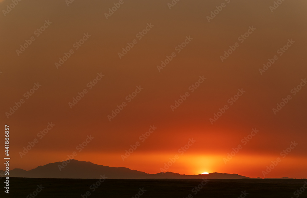 Solid Orange Sunset on Great Plains of Wyoming with Mountains