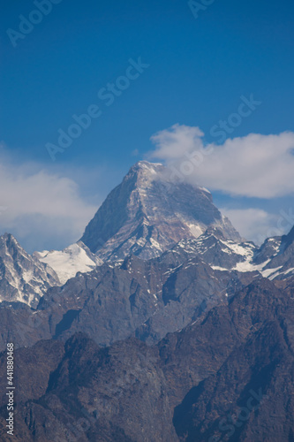 snow covered himalayan peaks on a bright sunny day