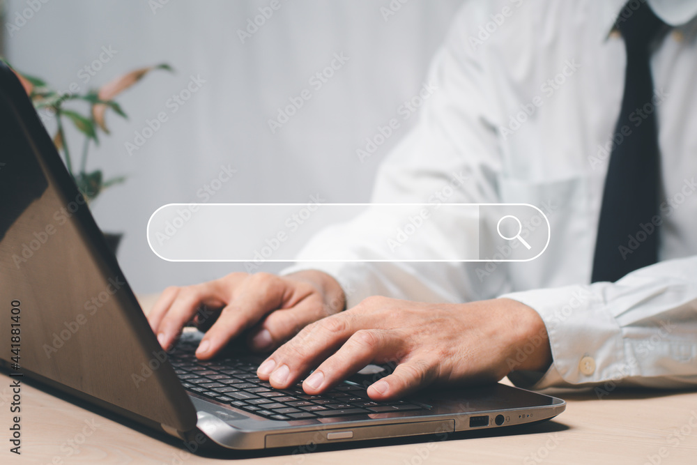 businessman's hands are using a computer keyboard to Searching for information data. The concept is Technology Search Engine Optimization. Using Search Console with the website. businessman's hands are using a computer keyboard to Searching for information data. The concept is Technology Search Engine Optimization. Using Search Console with the website.