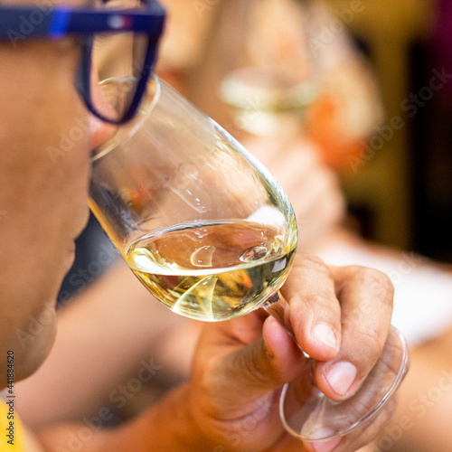 hand with glass of wine