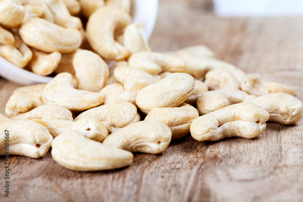healthy raw cashew nuts, close-up of peeled cashews healthy raw cashew nuts, close-up of peeled cashews