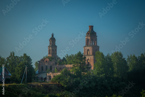 the old building of an abandoned orthodox church built of red brick gradually collapses without people © Dmitrii