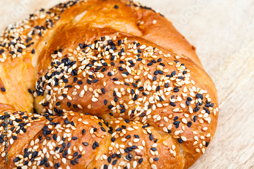 wheat bun sprinkled with sesame and flax